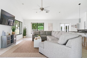 Spacious and comfortable living area with ample seating, perfect for gatherings and relaxation.