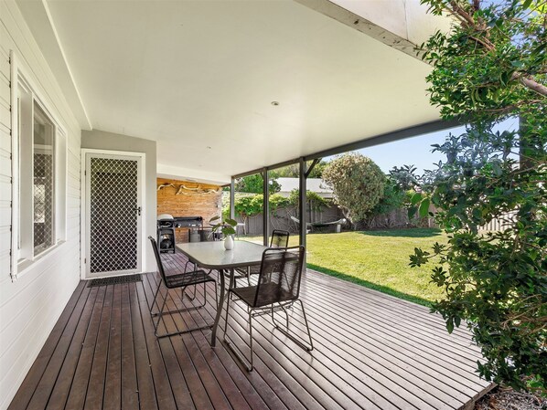 Alfresco comfort awaits you on the patio — stylish, shaded, and serene.