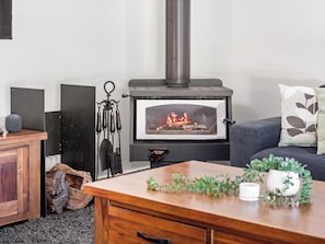 The fireplace adds a touch of warmth to your Dawesville getaway.