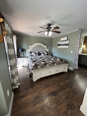King size bed in bedroom with ensuite bath