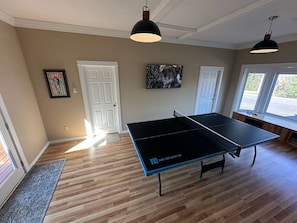 Large screen TV in game room.