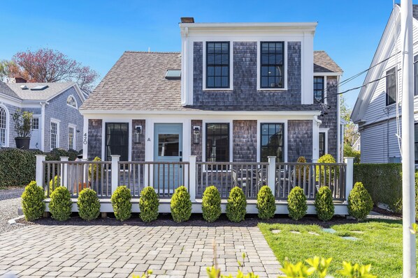 Front of house with private, furnished deck facing Commercial Street.