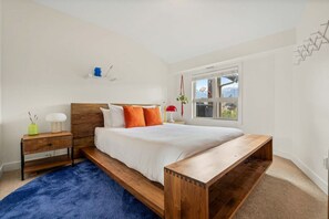Primary bedroom with a queen bed, walkthrough closet & private ensuite full bathroom.