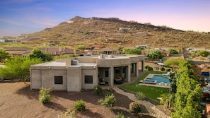 Mountain View Backyard with pool and hot tub with cornhole, axe throwing, and tv near patio-set