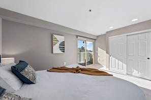 Relax & unwind in this ocean-view bedroom.