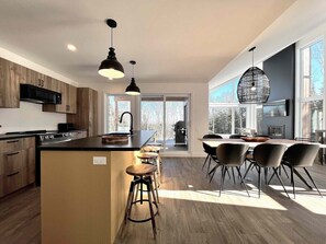 Open kitchen with forest views
