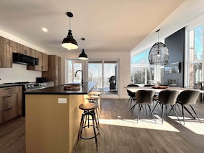 Open kitchen with forest views