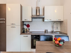 Kitchen Appliance, Kitchen, Countertop, Cabinetry, Major Appliance, Furniture, Home Appliance, Interior Design, Kitchen Stove, Wood