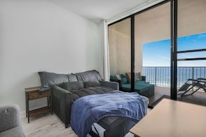 Love seat in the living area will fold out to a small bed.
