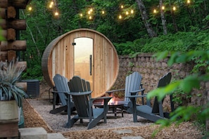 6 person sauna shared between the small and big cabin. The fire pit you see in this photo is private to the big cabin only.