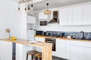 The kitchen is fully equipped to prepare a simple meal