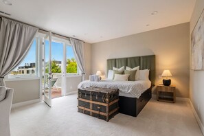Enjoy the ultimate comfort in this massive king bedroom, complete with a walk-in closet, private balcony, and a spa-like ensuite bathroom with a jacuzzi tub and dual showerheads.