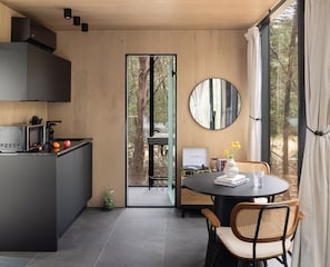 Kitchenette With All Cooking Utensils and A Private Dining Area