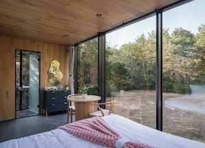 Spacious Interior Surrounded By A Lush Forest
