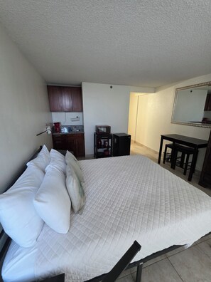 queen size bed 
with  dining are and dresser 