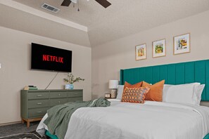 Contemporary bedroom retreat, complemented by subtle decor touches.