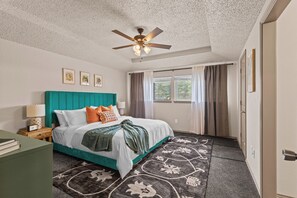 Contemporary bedroom retreat, complemented by subtle decor touches.