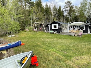 Spacious beach area. Sand and children play-friendly lake bottom.