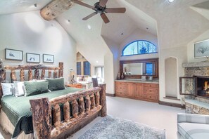 Bedroom 4: Fourth floor, king bed, en-suite bathroom with standalone tub, steam shower, deck access, dedicated workspace, TV with advanced cable, fireplace