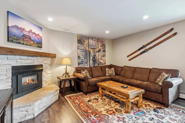 Living room: Sofa bed, Roku TV with cable, gas fireplace, central heat, no A/C