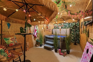 Your tropical escape awaits! Dive into relaxation with our shared hot tub.