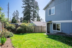 The entrance feels inviting, and the backyard provides a peaceful space to unwind.
