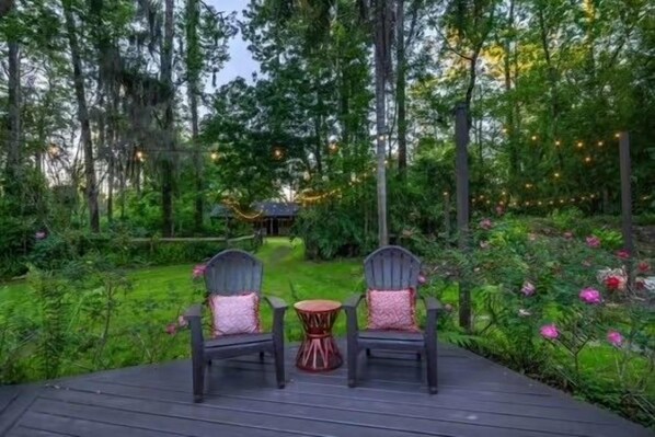 Enjoy the birds, nature sounds and mature park like setting on the massive deck