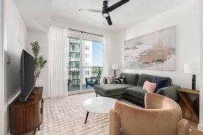 Sink into the style and comfort of this modern living area, complete with an eye-catching accent chair.