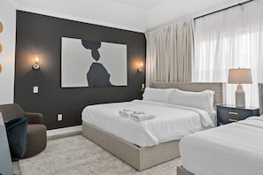 2 king bed ensuite, 65 inch TV, desk, dresser