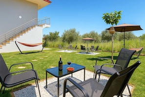 A green open space perfect for lounging, reading, or enjoying a sunny afternoon.
