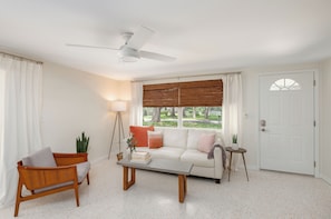 Living Room features a white leather sofa