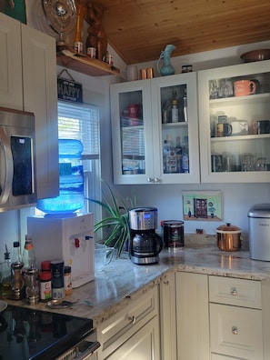 Coffee pot and water cooler.
