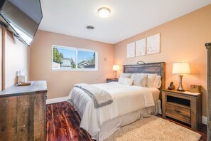 Welcome home to a spacious bedroom with luxury queen-sized