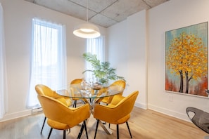 Dining space with artistic flair and sunny views