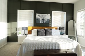 Master bedroom with private covered balcony and King bed and TV