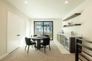 3rd level family room with a game table and wet bar