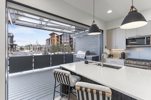Blend outdoor and indoor space at the click of the garage door opener!