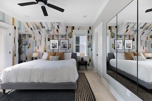 Primary bedroom with full length mirror wall (125 Lucile)