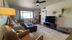 Living room facing street view with power recliner in the foreground. 