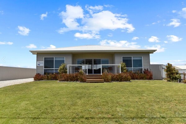 Walk the path from the front door, through native bush to the beach