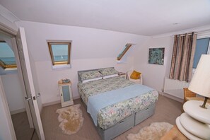 Bedroom two has a king-sized bed with a pocket mattress 