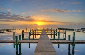 Take a sunset stroll on the boat dock.