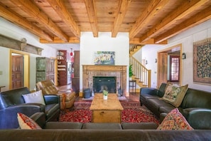 Main floor living area with fireplace and small library