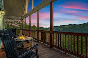 Twilight deck retreat with cozy firepit and panoramic Smoky views