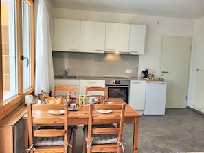 Furniture, Interior Design, Flooring, Kitchen, Floor, Wood, Major Appliance, Kitchen Appliance, Room, Cabinetry