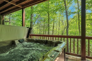 Unwind in the hot tub while soaking in the scenic views of fighting town creek.