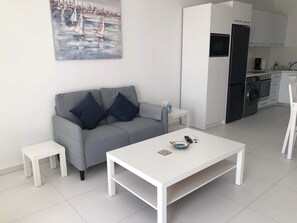 Open plan living room, dining room and kitchen