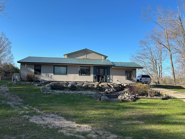 Front view of home from spacious front yard
