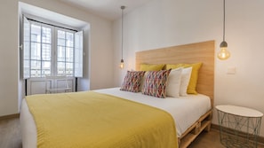 Comfortable bedroom with bright colors and natural light. #Portugal #PT #Lisbon #midtermrental #cozyhome