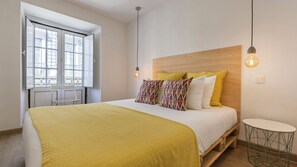 Comfortable bedroom with bright colors and natural light. #Portugal #PT #Lisbon #midtermrental #cozyhome